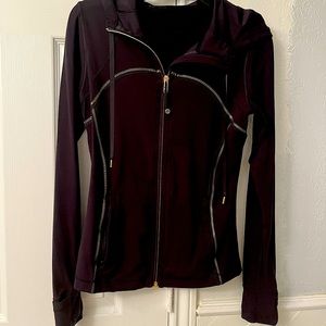 Lululemon black with gold detailing and gold zipper